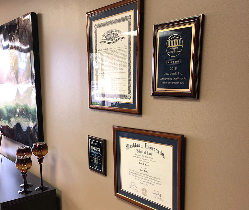 Photo of awards and certificates on display in the firm's office